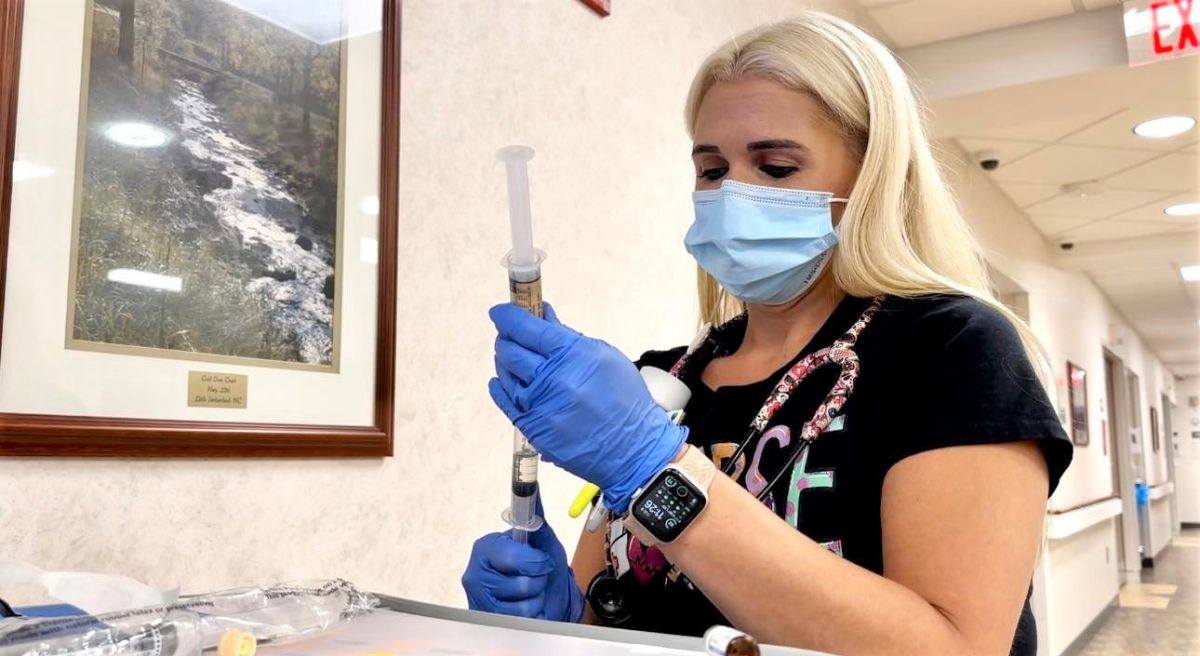 Lisa Fleming, RN, prepares medication for a patient on 4th Surgical.