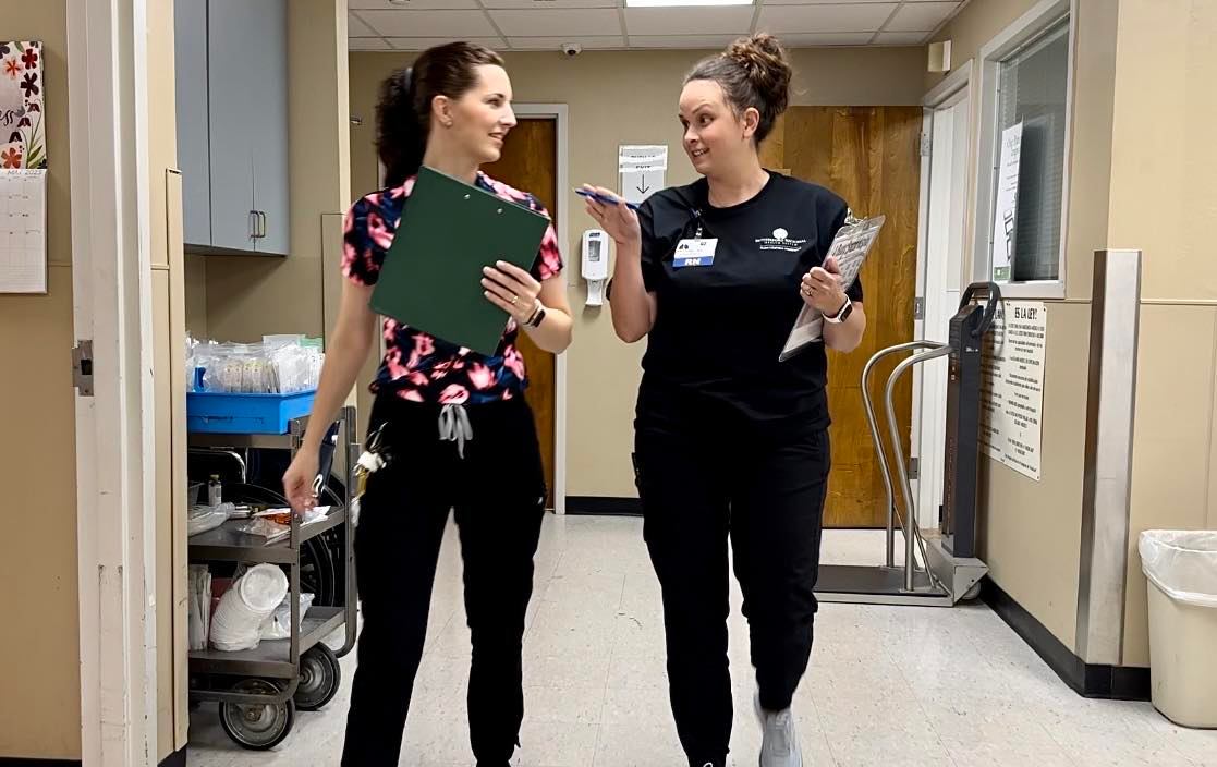 Cherish Anderson, left, and Brittany Owens walk through the ED at RRHS.